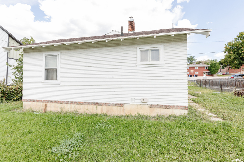 View of home\'s exterior featuring a yard