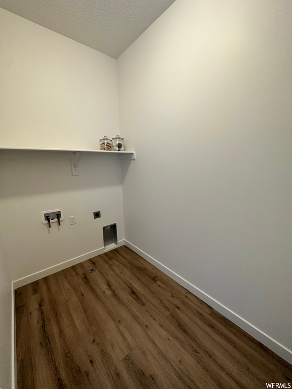 Washroom featuring hookup for an electric dryer and dark hardwood flooring