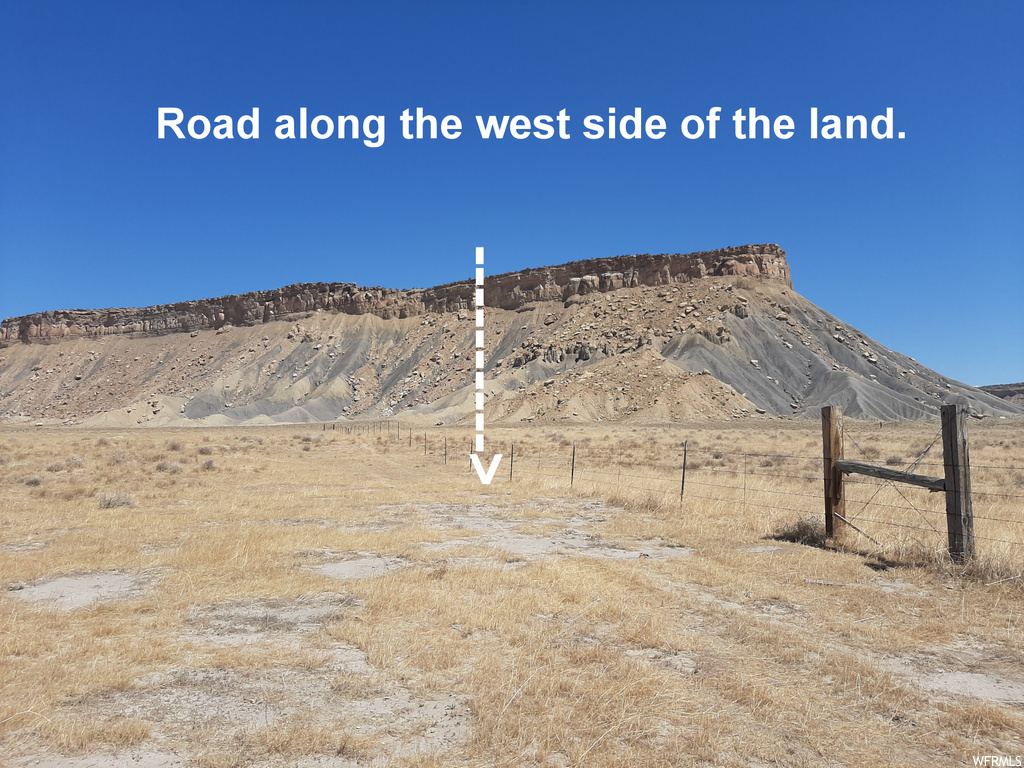 Property view of mountains with a rural view