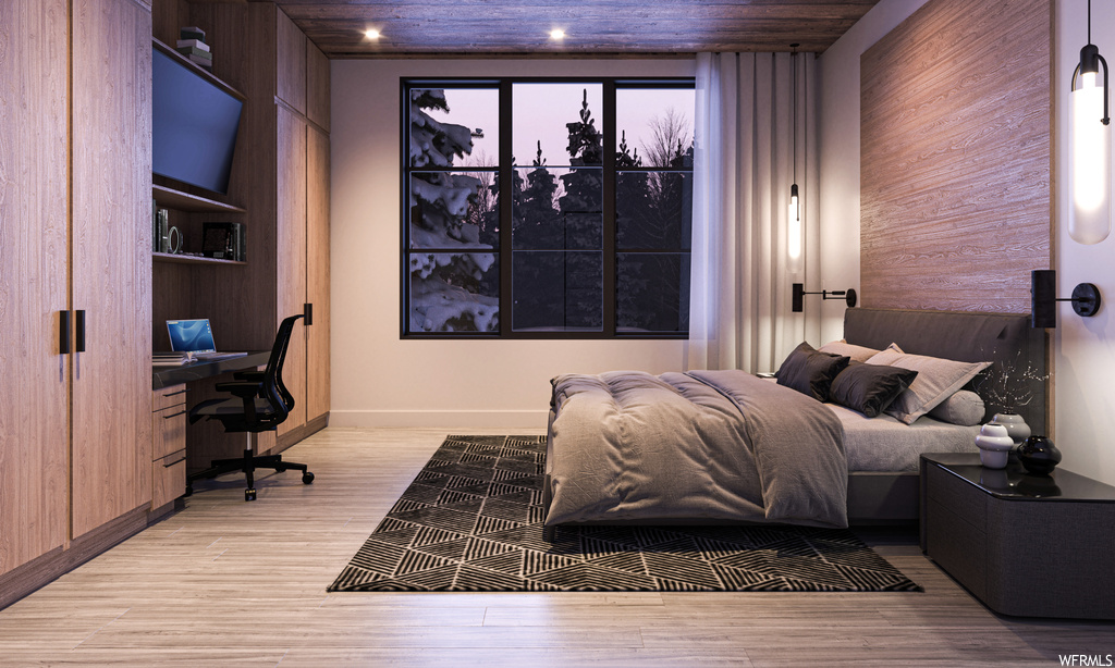 Bedroom with wooden walls, wooden ceiling, and light hardwood flooring