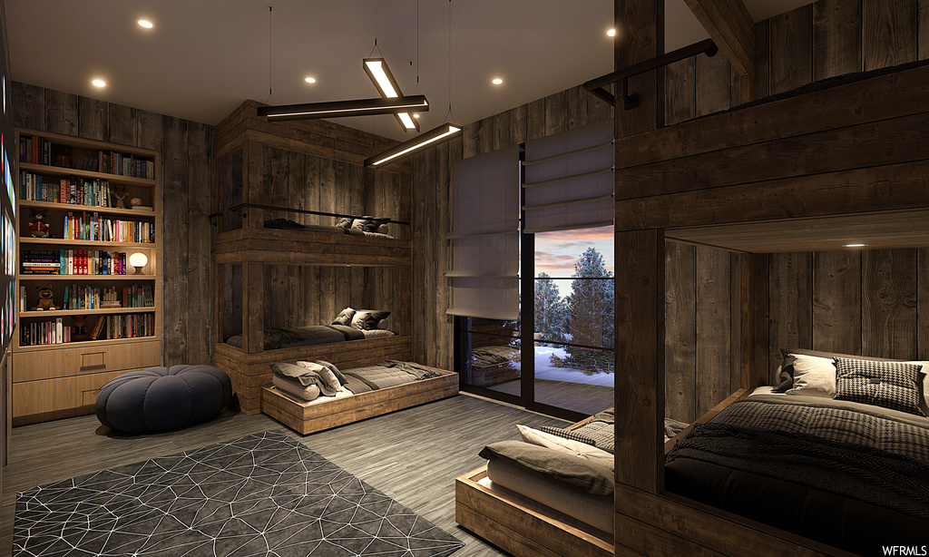 Hardwood floored bedroom with wooden walls