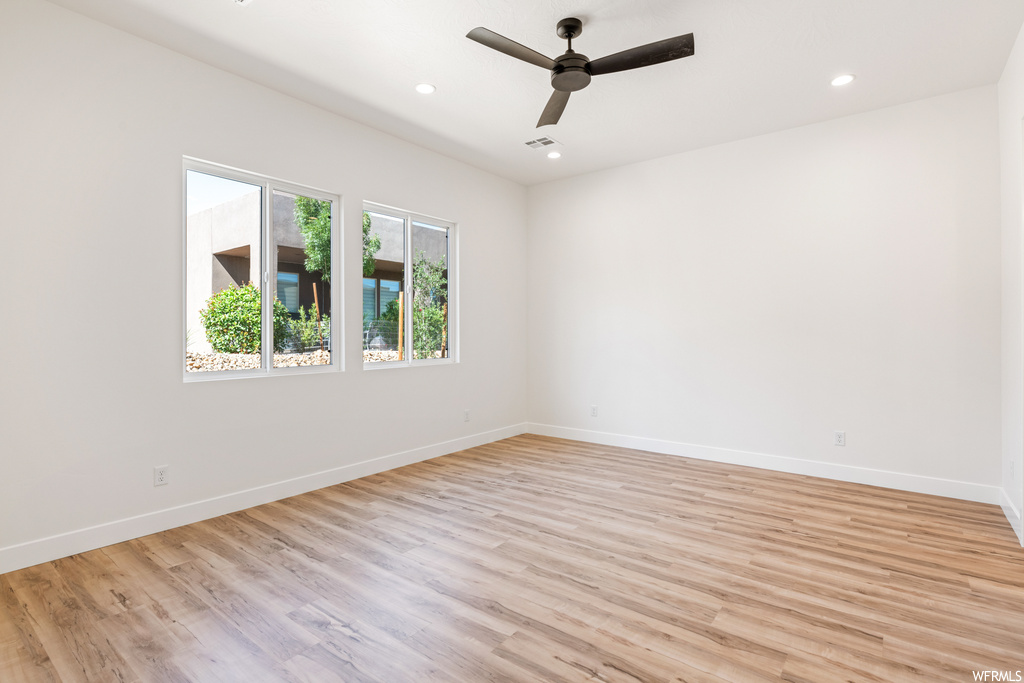 Unfurnished room featuring light hardwood flooring and ceiling fan