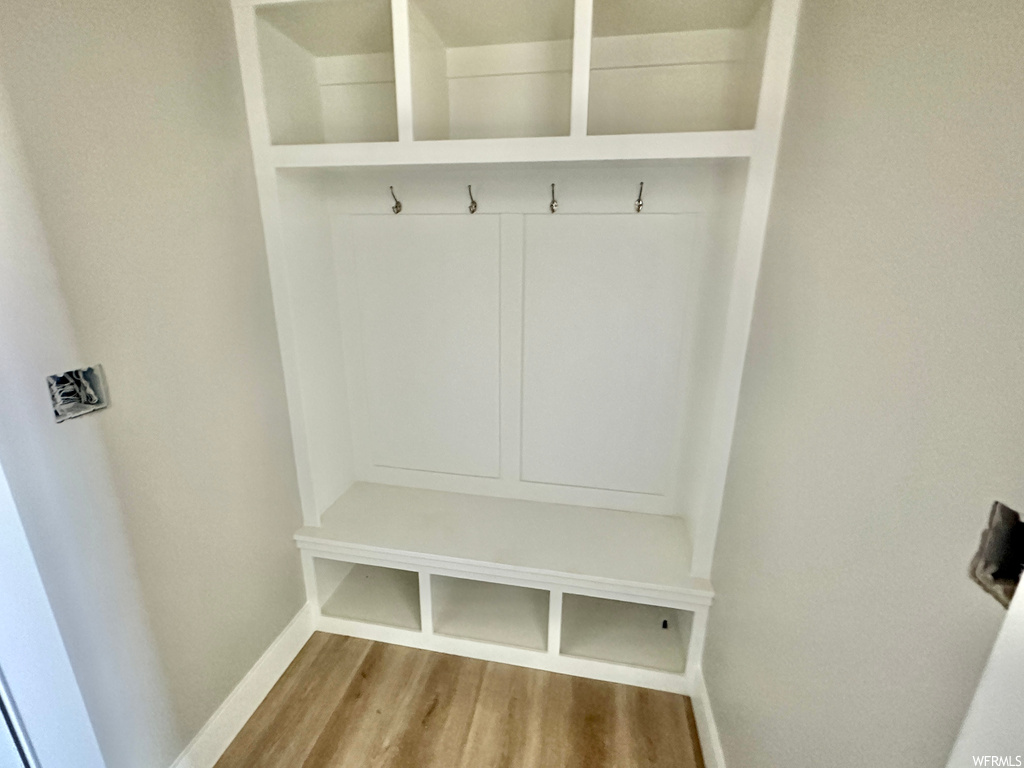 Mudroom featuring light hardwood flooring