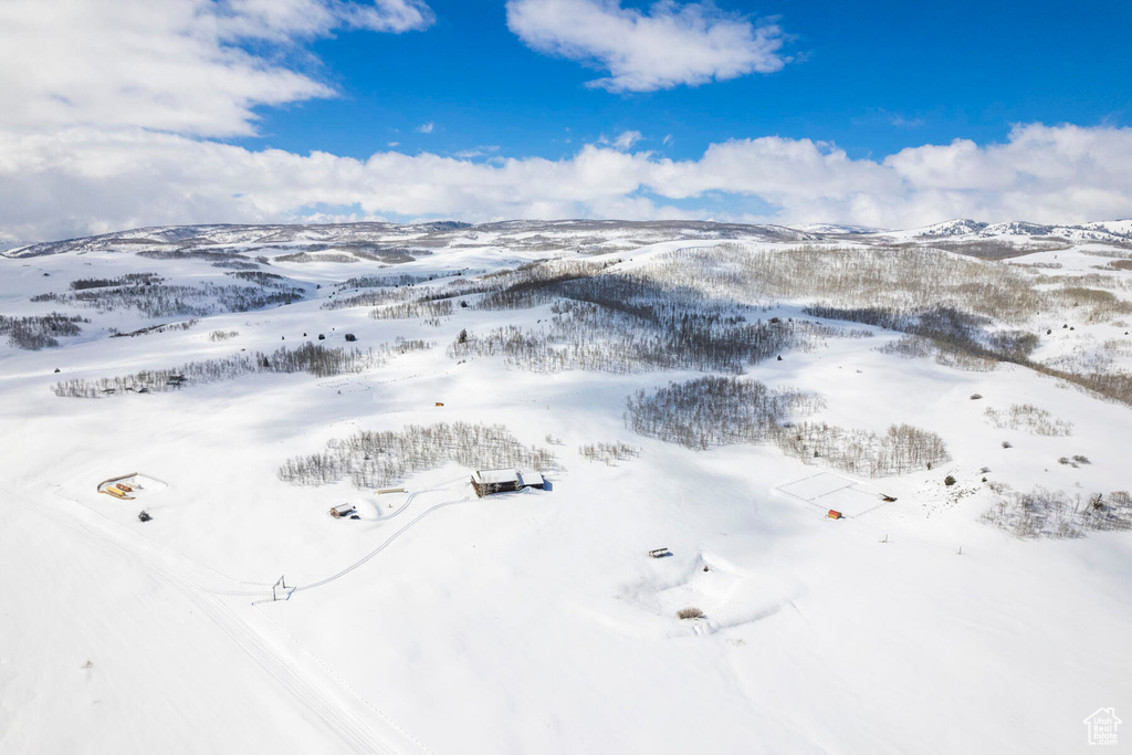 Snowy aerial view featuring a mountain view