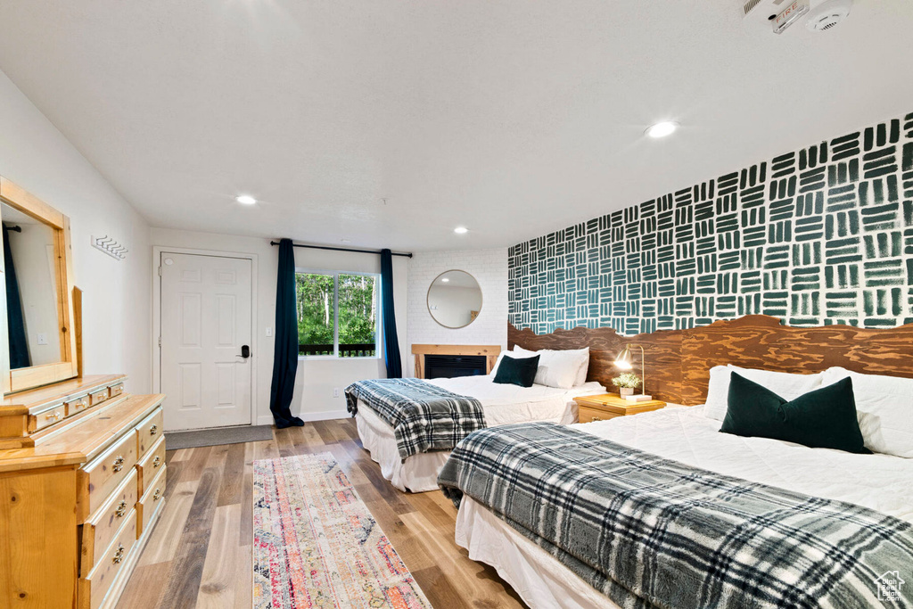 Bedroom with light hardwood / wood-style flooring