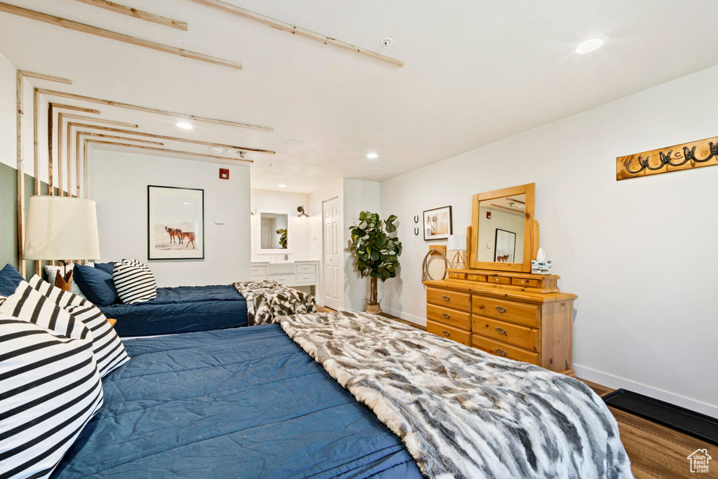 Bedroom featuring wood-type flooring