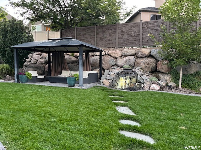 View of yard with a patio area, a gazebo, and outdoor lounge area