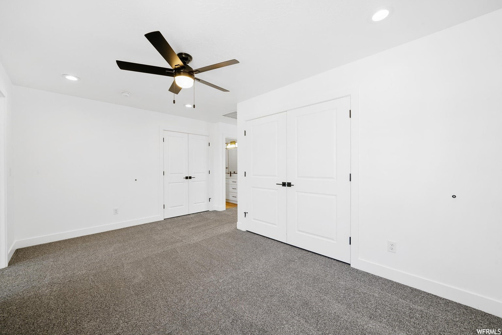 Unfurnished room with light carpet and ceiling fan