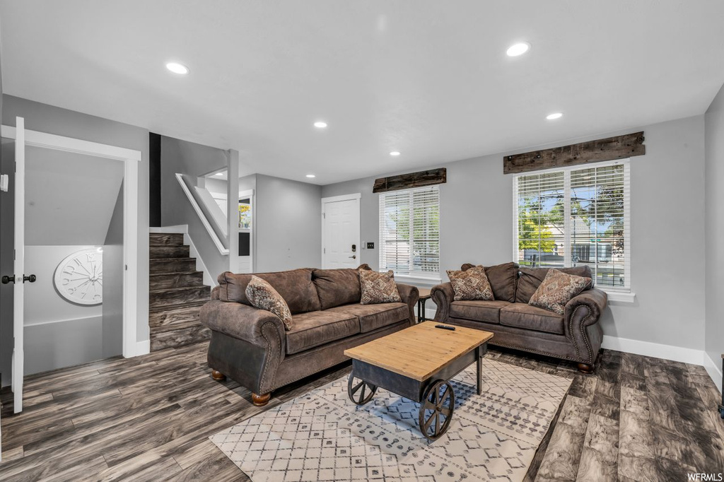 Living room featuring dark hardwood flooring