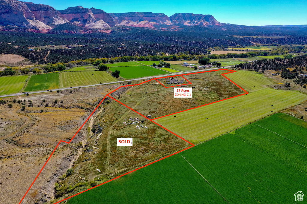 Drone / aerial view with a mountain view and a rural view