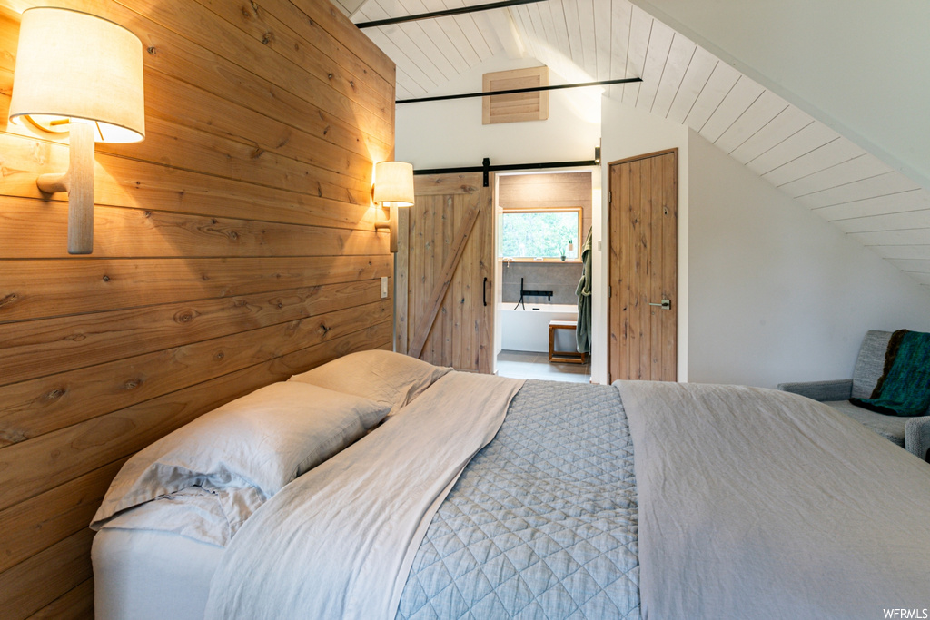 Bedroom featuring lofted ceiling