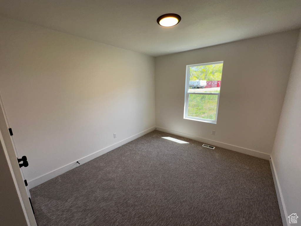 View of carpeted spare room