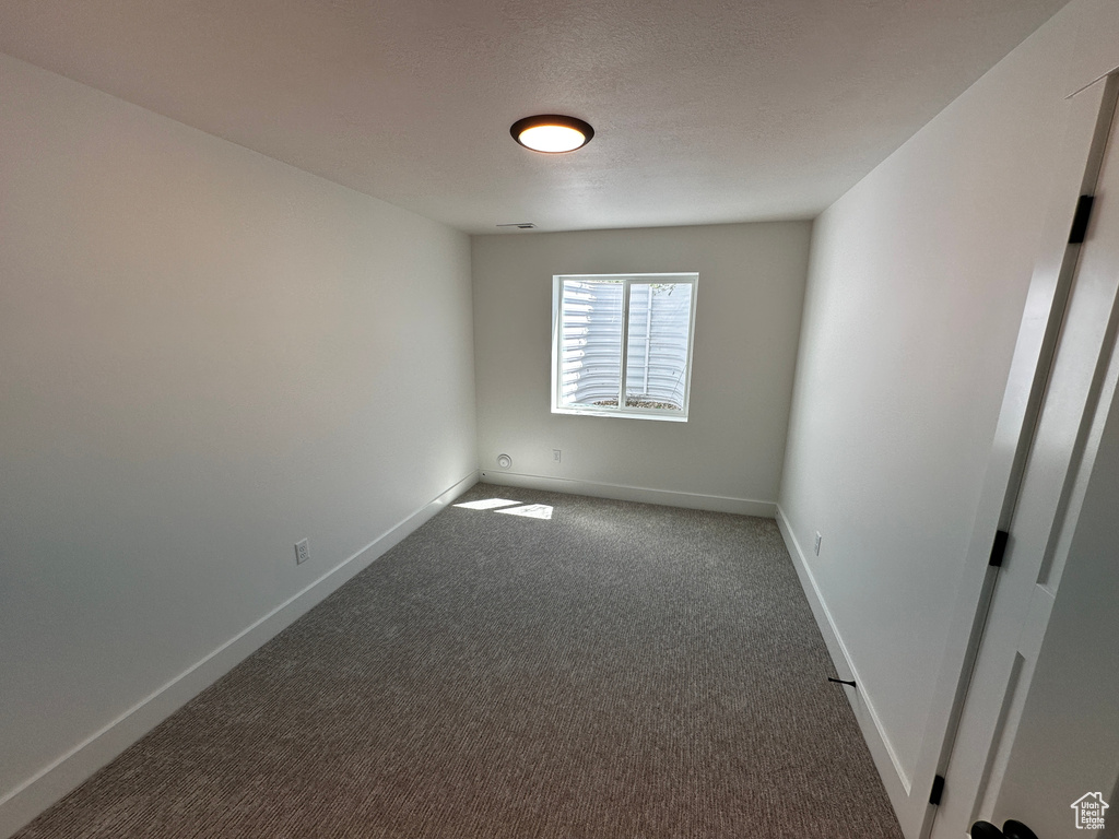 Unfurnished room with carpet flooring