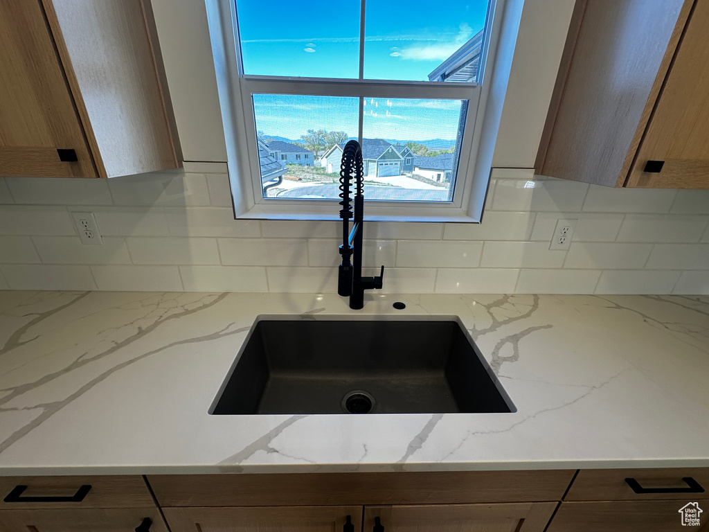 Room details with backsplash and sink