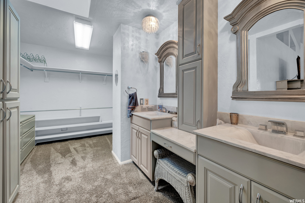 Bathroom with dual vanity and mirror