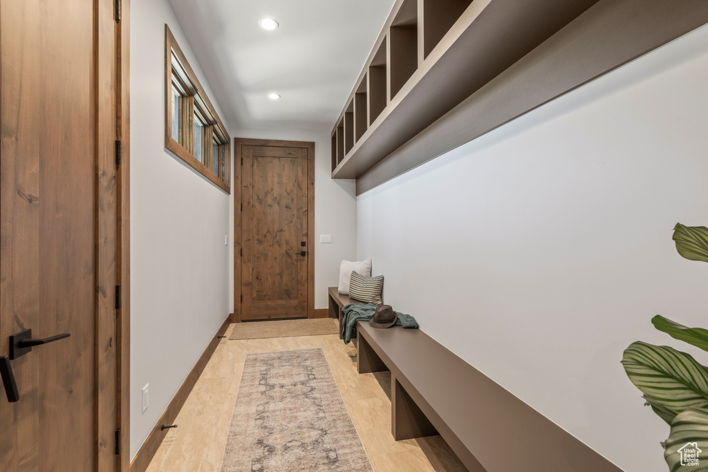 Mudroom with light hardwood / wood-style floors