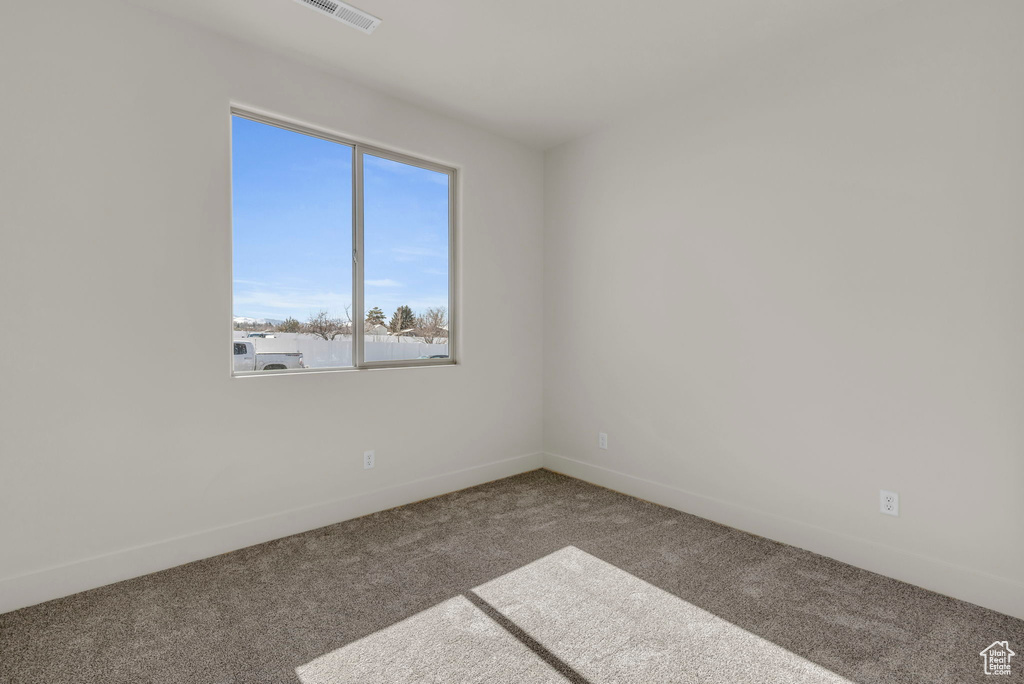 Spare room with carpet floors