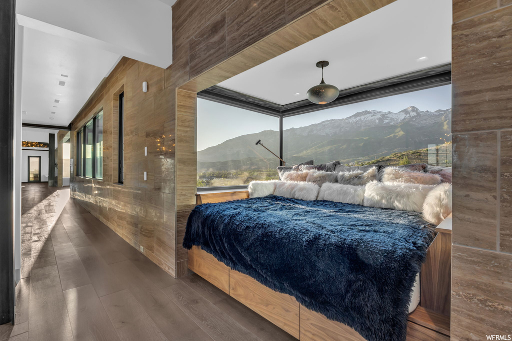 Hardwood floored bedroom with a mountain view