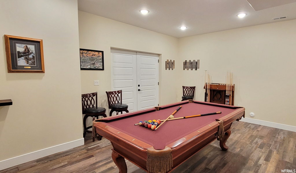 Recreation room featuring dark hardwood floors and billiards