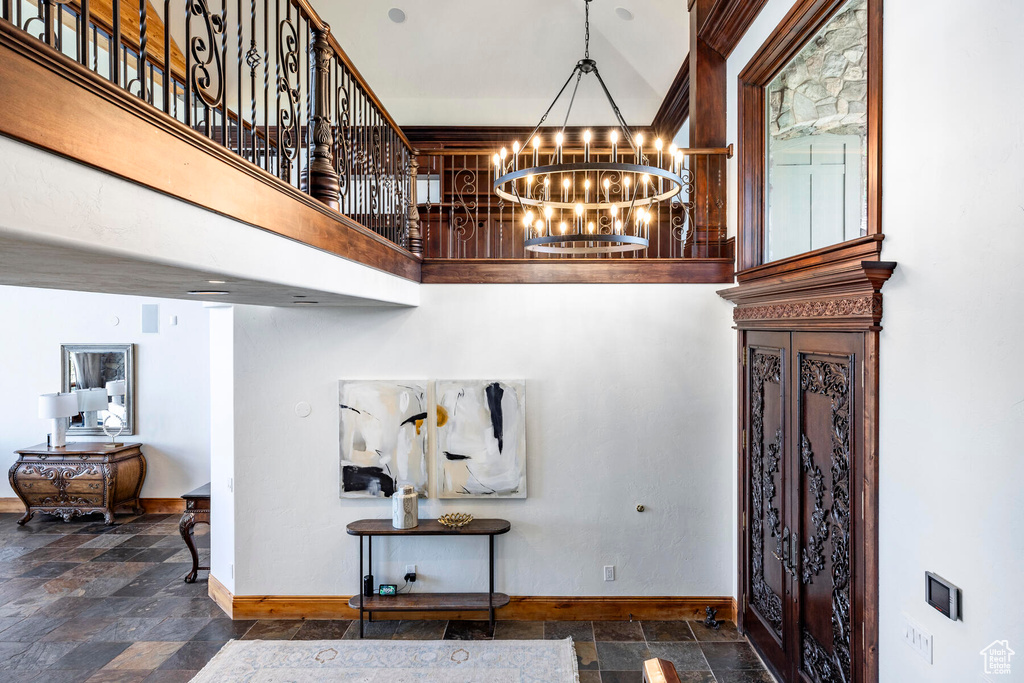 Foyer entrance featuring a notable chandelier