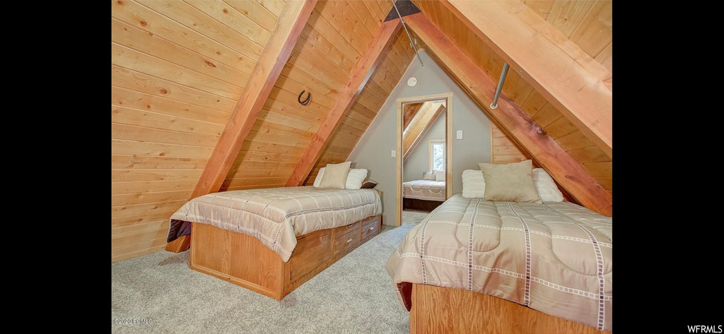 Carpeted bedroom featuring wooden ceiling, wood walls, and lofted ceiling with beams