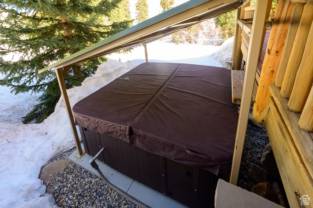Exterior space with a hot tub