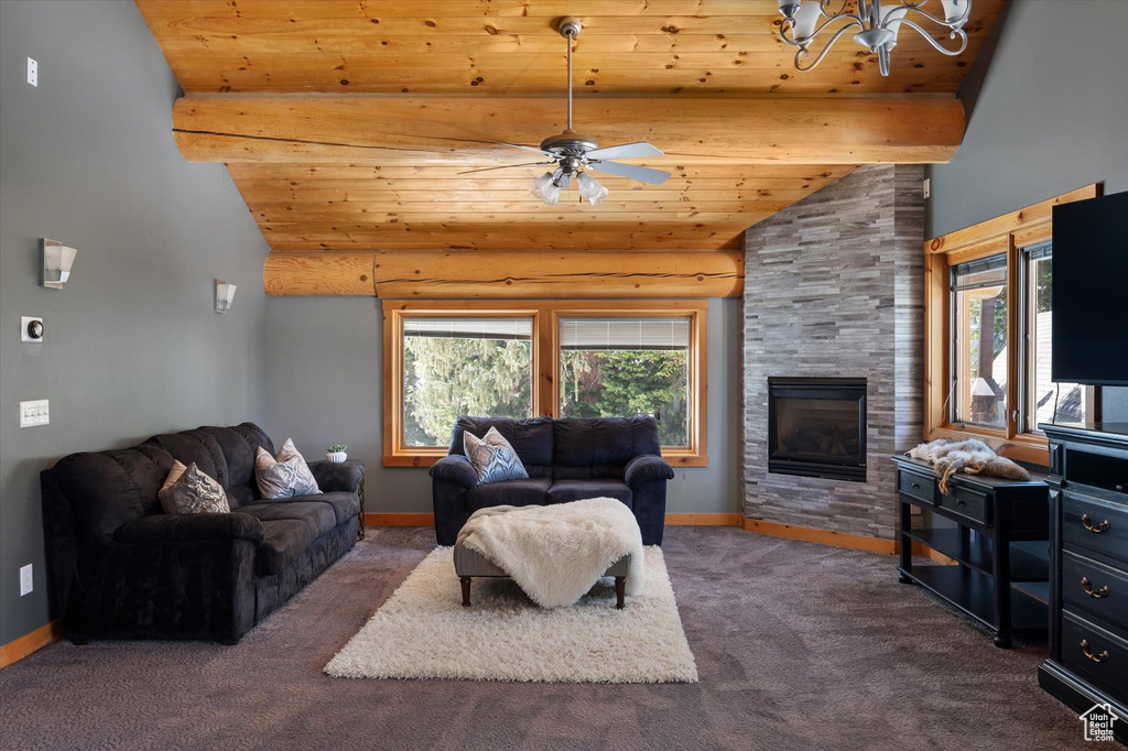 Carpeted living room featuring wooden ceiling, plenty of natural light, baseboards, ceiling fan, and high vaulted ceiling