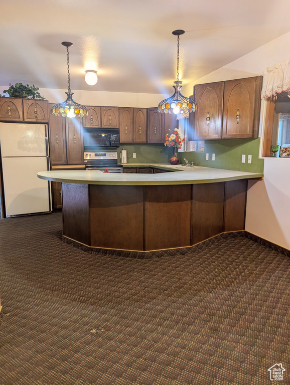 Kitchen with black microwave, stainless steel range with electric cooktop, dark colored carpet, and freestanding refrigerator