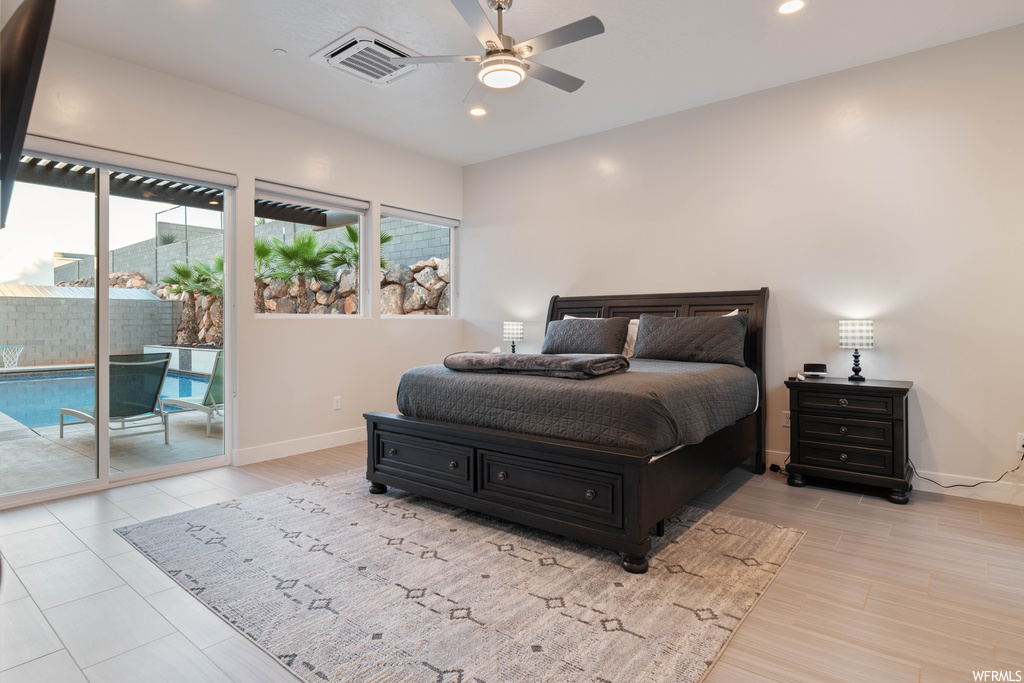 Bedroom featuring ceiling fan and access to outside