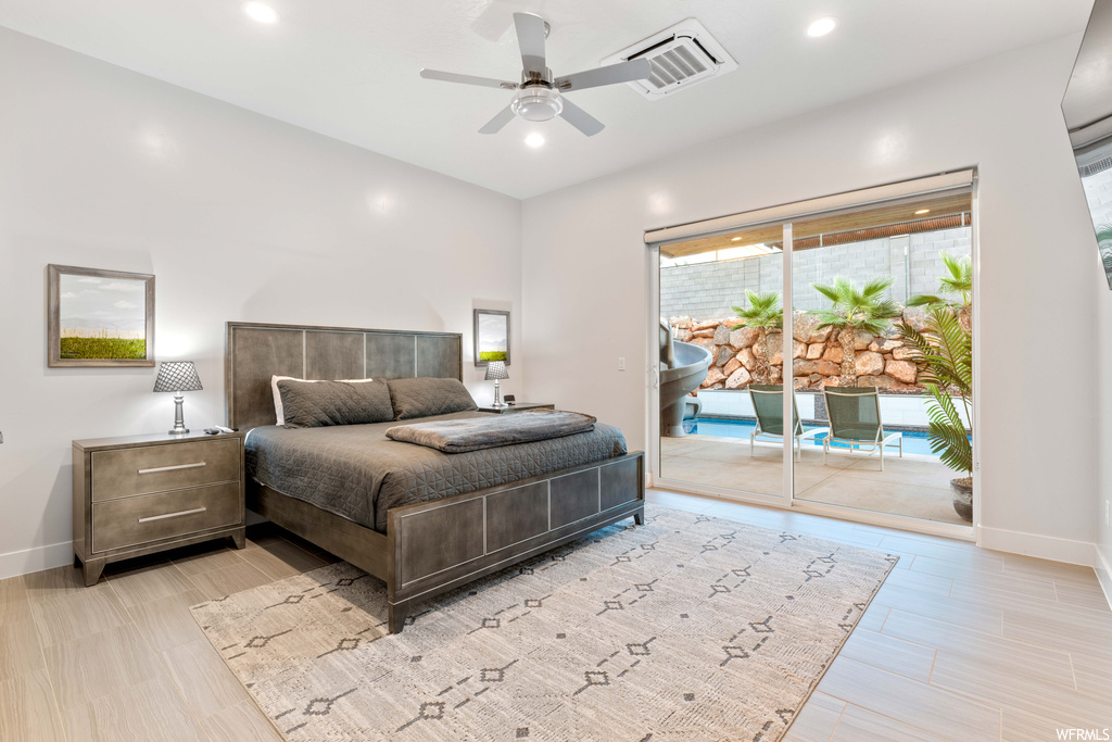 Bedroom with access to exterior and ceiling fan