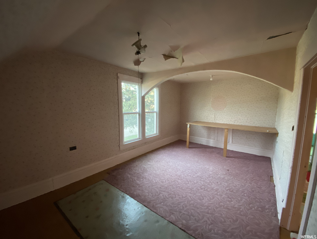 Spare room featuring carpet flooring