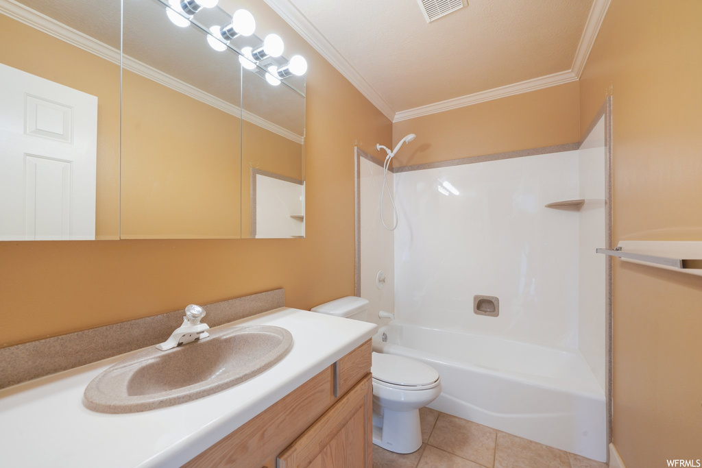 Full bathroom with toilet, shower / bathing tub combination, large vanity, and ornamental molding