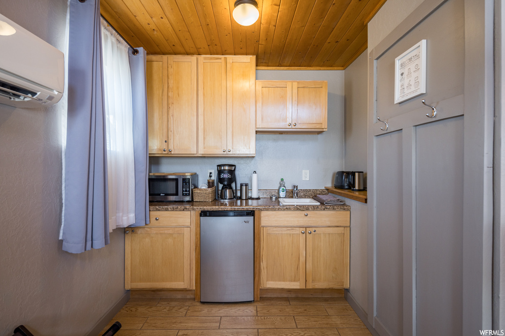 Kitchen featuring light brown cabinets, a wall mounted air conditioner, wooden ceiling, light hardwood / wood-style floors, and stainless steel appliances