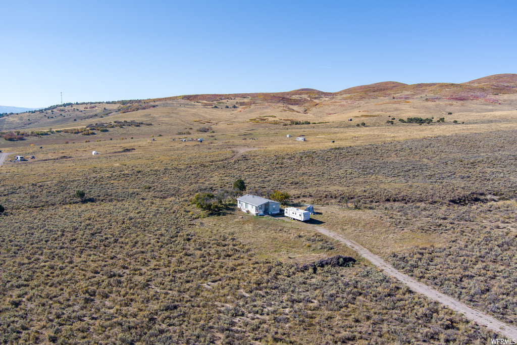 Birds eye view of property featuring a rural view and a mountain view