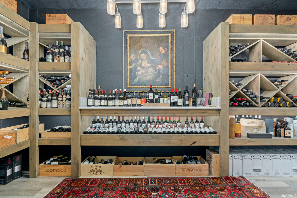 Wine room with light hardwood floors