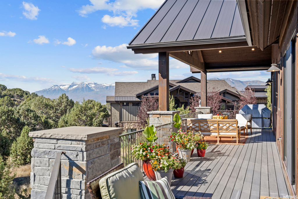 Exterior space with a mountain view and an outdoor living space