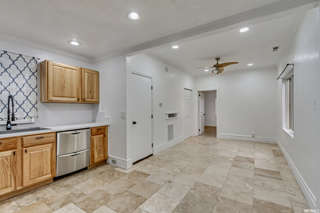 Kitchen featuring sink, ornamental molding, ceiling fan, dishwasher, and light tile flooring