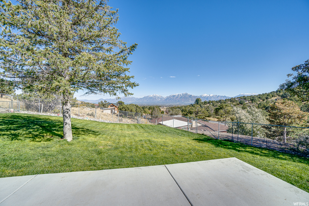 View of yard with a patio area and a mountain view