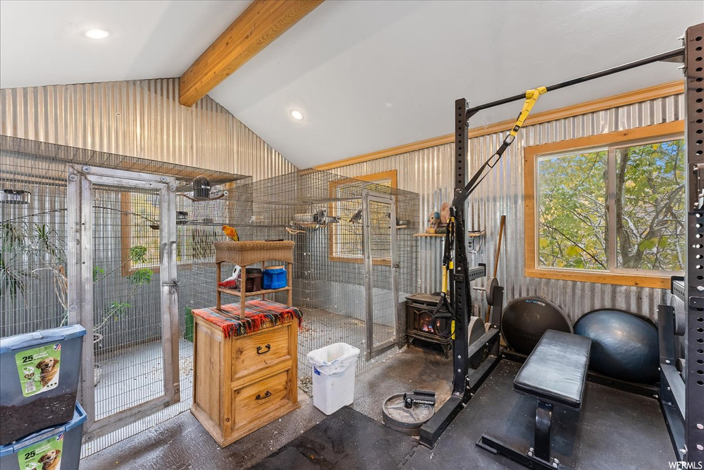 Workout area featuring vaulted ceiling