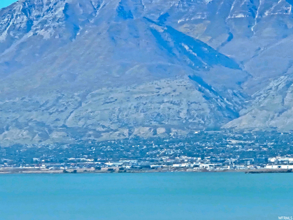 Property view of water with a mountain view
