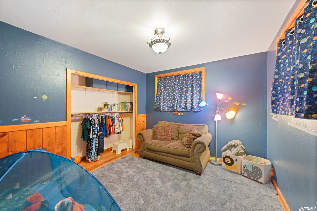Bedroom featuring a closet and light hardwood flooring