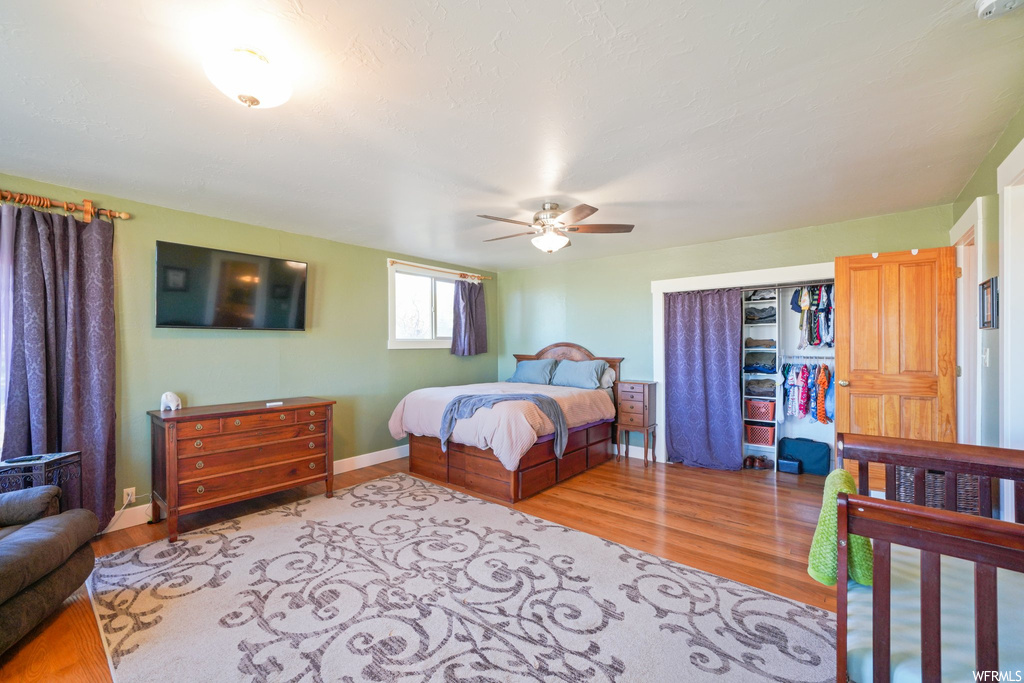 Bedroom featuring light hardwood floors and ceiling fan