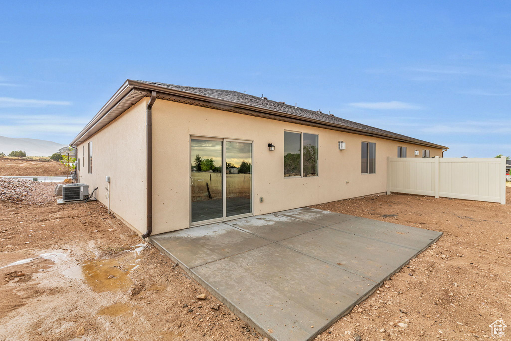 Back of property featuring a patio and central air condition unit