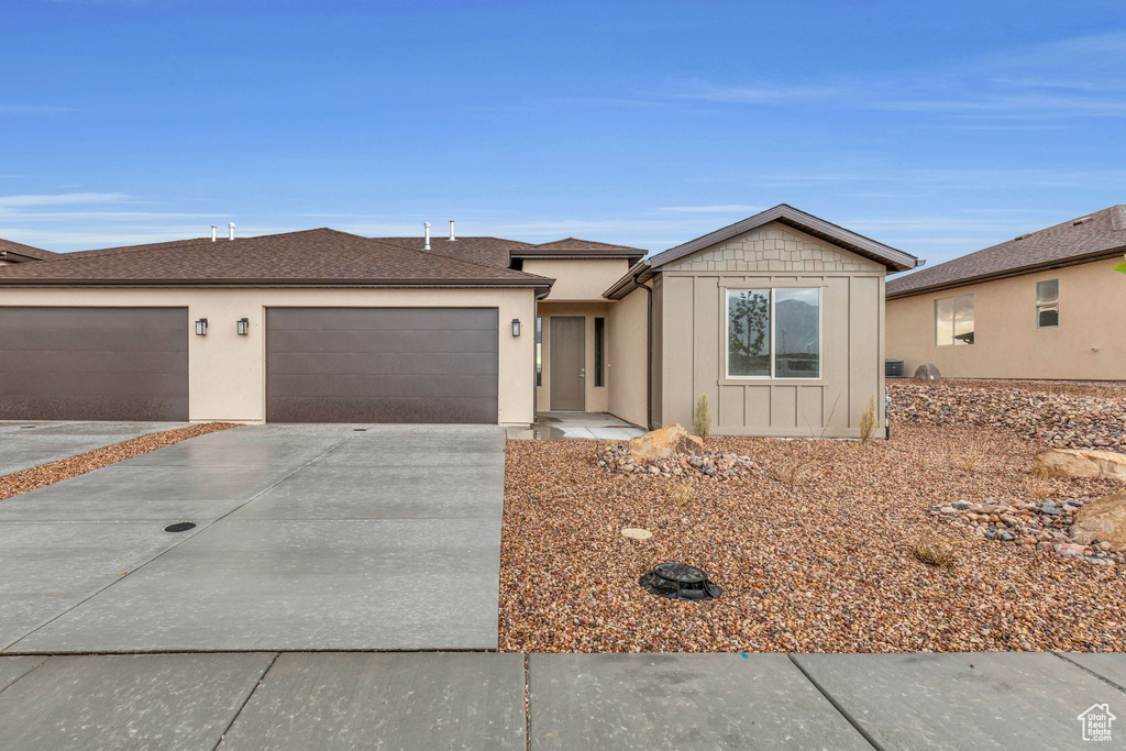 Ranch-style home featuring a garage