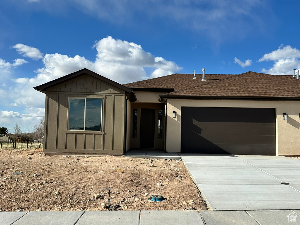 Single story home featuring a garage