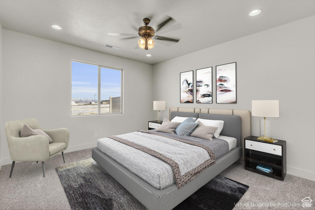 Bedroom featuring ceiling fan and light carpet