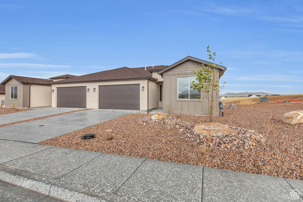 Ranch-style home featuring a garage