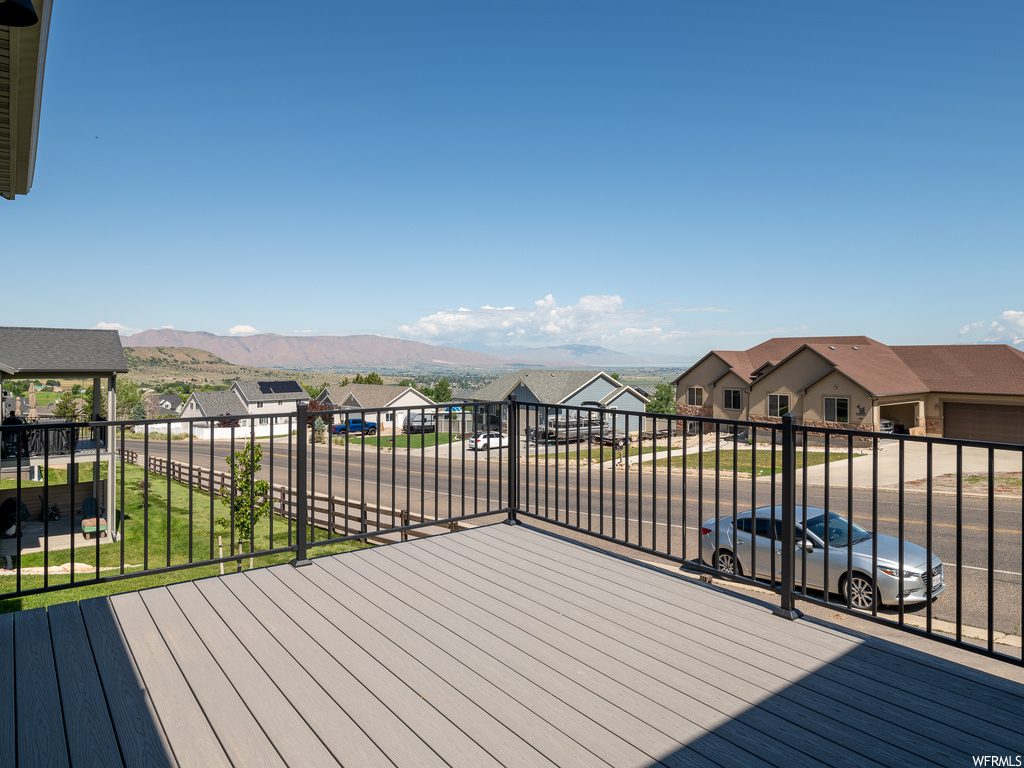 Wooden terrace featuring a mountain view