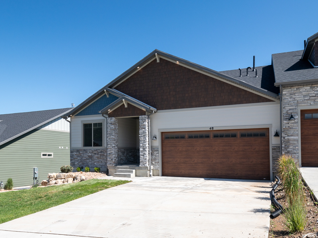 Craftsman inspired home with a garage