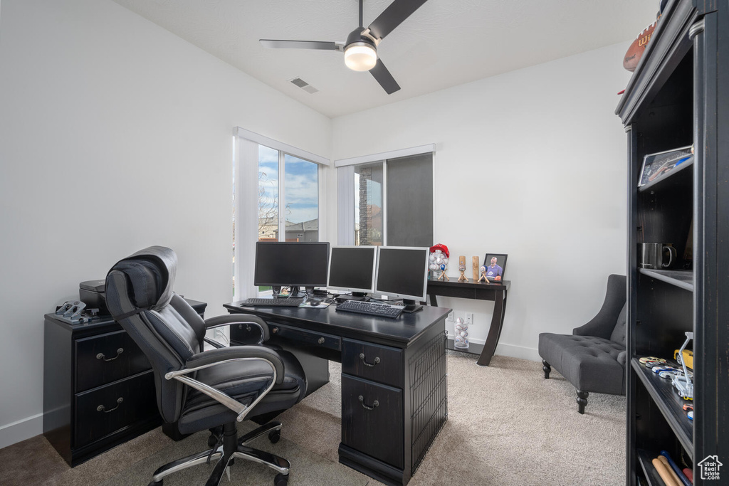 Office featuring light carpet and ceiling fan